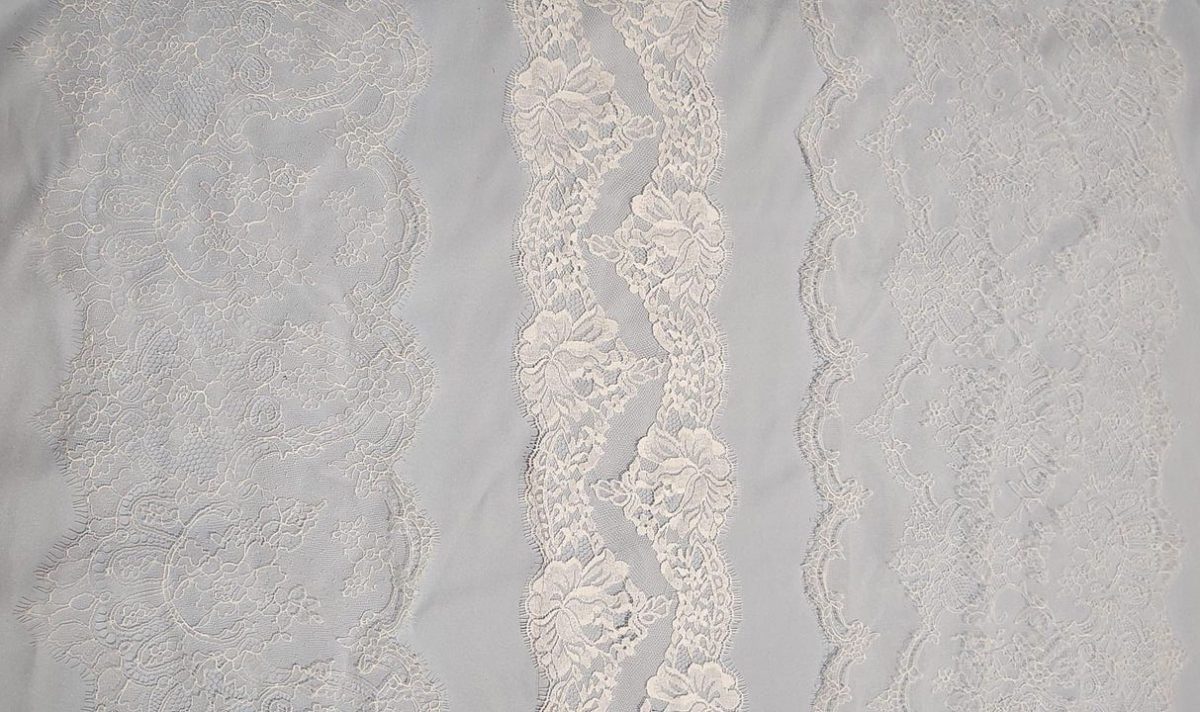 Three lace options layered over pale blue silk